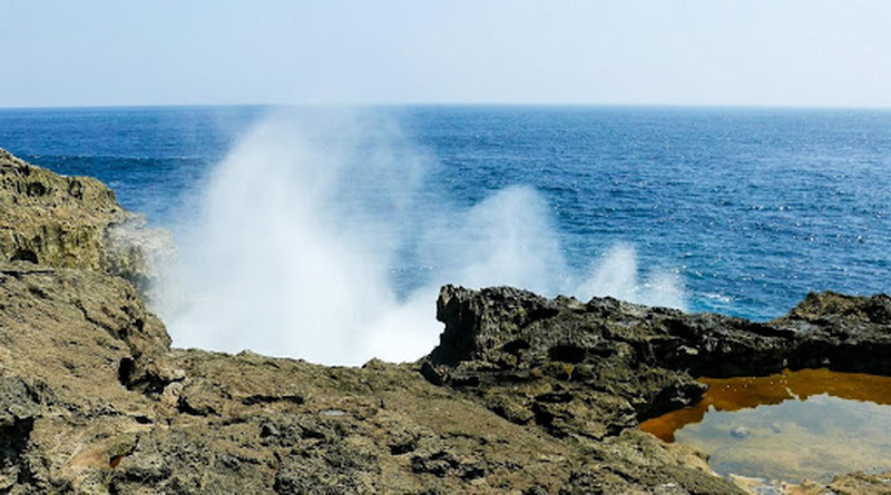 Smoky Beach (Pasih Andus): Jagged Coastal Rock Formations, Sea Mist, and Naturally Formed Rock Pools Smoky Beach (Pasih Andus): Jagged Coastal Rock Formations, Sea Mist, and Naturally Formed Rock Pools